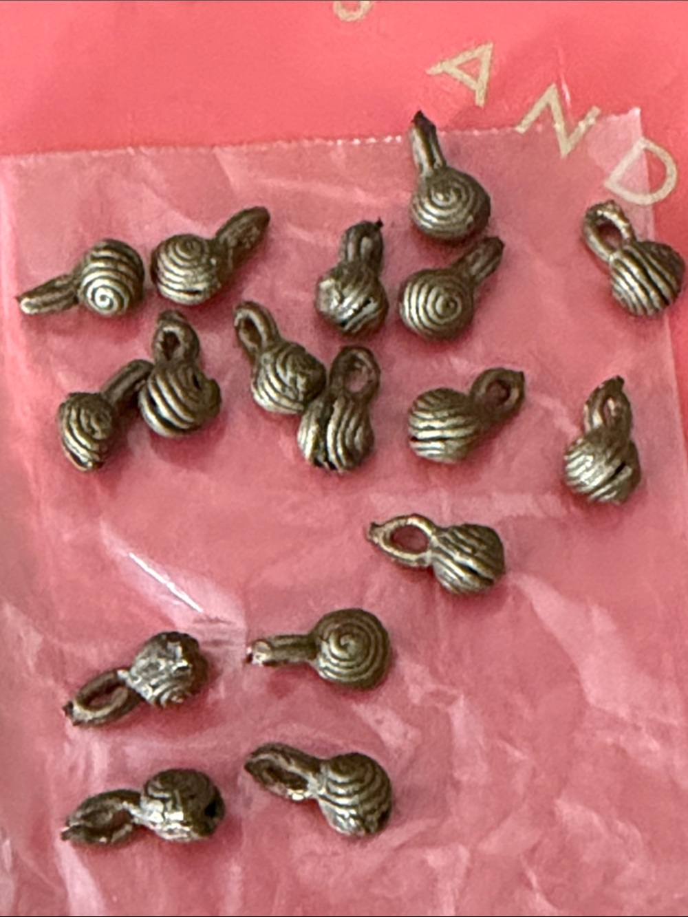 Seventeen handmade dark brass beads 
 holes st the top great for making jewelry